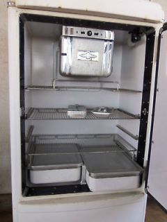 Old refridgerator made by General Motors , ice box antique