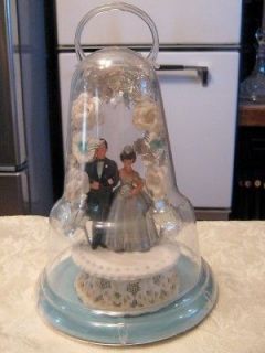   GROOM WEDDING CAKE TOPPER CERAMIC W FLOWERS COVERED BY PLASTIC DOME