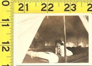 A638   Vintage 1920s Photograph   Cute Girl on Cot in Tent