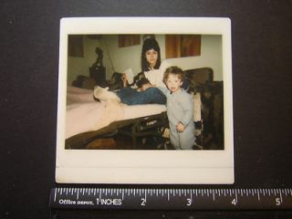 Modern Color Polaroid 0671 mom sits on hideaway bed w dog in lap & boy 