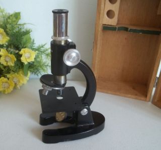 Vintage Monolux microscope with wooden box