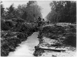   pipeline under construction Clam shell digger making ditch,1942