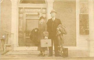 REAL PHOTO OLD COUPLE STANDING ON PORCH SUITCASES MAILED 1934 K20331