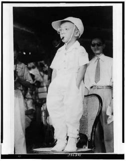 Vietnamese boy dressed,fashio​nable clothing,pipe,​mouth,children 