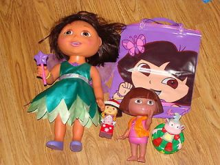 Lot of 4 Dora Dolls, Carry Purse, Christmas Figure & 2 Bath/Pool Float 
