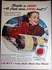 1949 Winter Scene girl on sled Lucky Strike cigarettes vintage ad