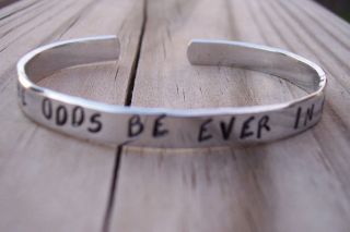   GAMES HAND STAMPED MAY THE ODDS BE EVER IN YOUR FAVOR CUFF BRACELET