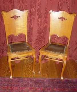   Pair of Antique Carved Tiger Oak Dove Chairs w Studded Leather Seats