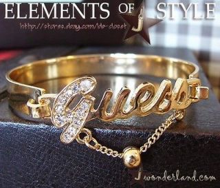 GUESS Classic Crystal G Gold Toned Bangle Bracelet