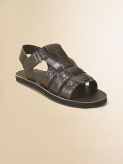 Faux leather upper with embossed logo Ankle strap with foldover grip 
