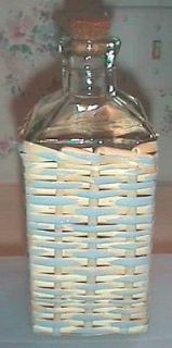 square bottle with wicker cover 8 inches tall time left
