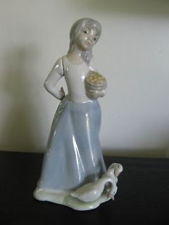 tengra spain girl with basket and ducks porcelain figurine from