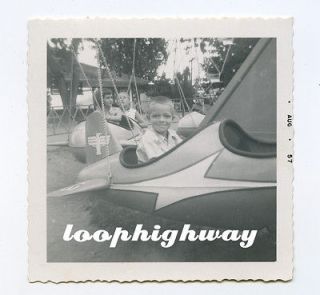 Cute Boy on Toy Plane/Rocket Merry Go Round Type Ride   Vtg 1957 Photo