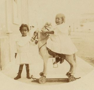 1909 Old REAL PHOTO Postcard with ANTIQUE TOY HORSE wood wheels