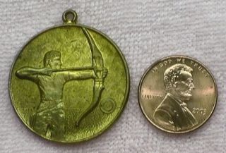   RARE   Raw Brass 1976 Olympics 33mm Medal   ARCHER   Bow and Arrow
