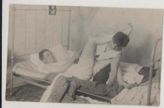 1910 college boys wrestling in bed in underclothes rppc time