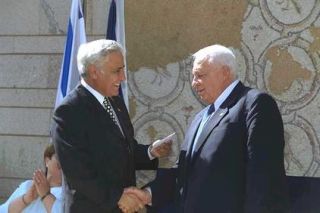 president moshe katsav presenting the ribbon to former president ezer 