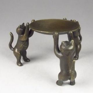 Chinese bronze lamps and lanterns, the three little kittens