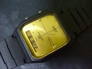 vintage casio analog digital dual time gold face watch from