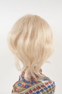   The tag reads  Charles Carroll 100% Human Hair, European Texture