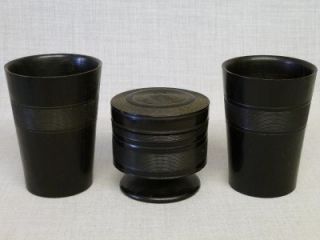 1920s ebony lidded container with two beakers