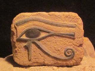 Egyptian Art   Eye of Horus and Ankh amulet. Ancient Egypt carving 