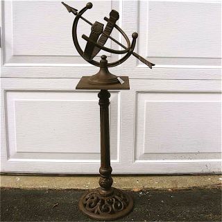 bowstring sundial with separate pedestal base cast iron in an antique 