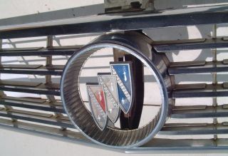   orignal grill, emblem, headlight backings and bezels for a 1963 Buick