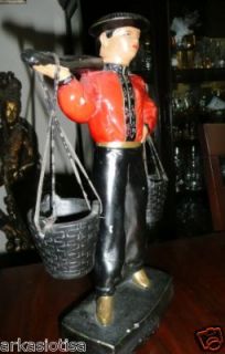 oriental man with hat and hanging buckets figurine