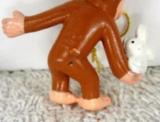 This is a set of three cute Curious George mini Christmas ornaments
