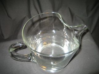  auction is for 2 glass items. They are both pitchers or decanters