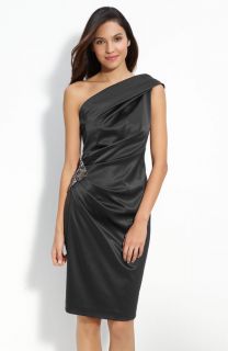 beaded medallion fashions the side of a satin one shoulder dress