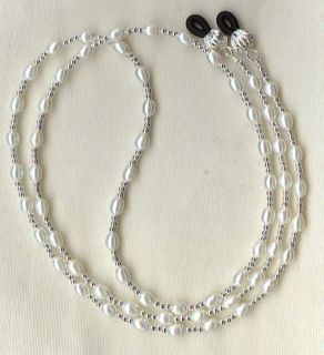 This pretty new eyeglass chain/holder is 27 inches long. It has