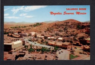 AZ Nogales Arizona International Fence Postcard Sonora Mexico Saludos