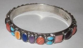 This auction is for Leo Feeney Bangle Bracelet made of Mutli Stone