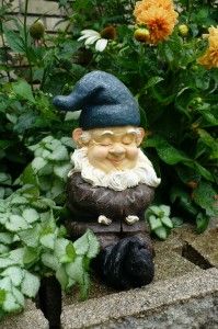 10 in garden gnome smiling arms folded across chest