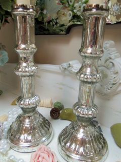  mercury glass candlesticks with lots of smooth and ribbed designs this