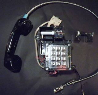 Phone Hand Set with metal clad Cord and Touch Tone Pad and Electronics