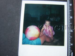 COLOR POLAROID U8852 BABY PLAYING WITH PERSON WITH BOUNCY BALL