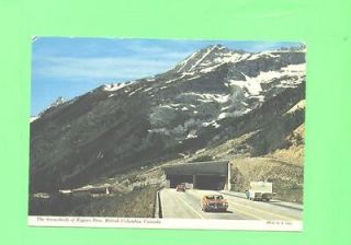 THE SNOWHEADS OF ROGERS PASS BRITISH COLUMBIA CAMPING TRAILER ON ROAD