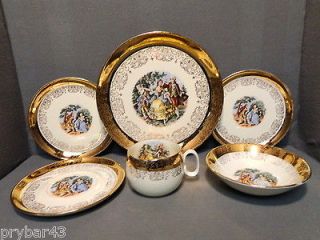 GOLD COURTING COUPLE DINNERWARE SERVICE FOR 8 AND SERVING PIECES