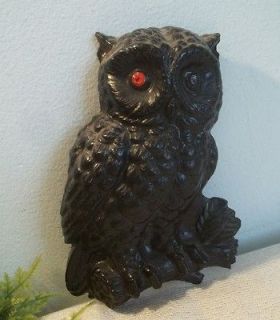 carved black coal OWL wall plaque with red sequin eyes.Coal Mountain