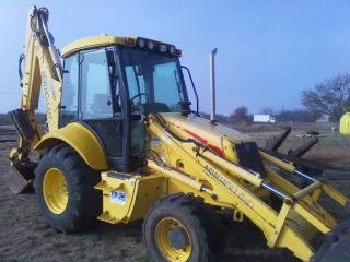 2006 New Holland lb 90 Backhoe with 4 Wheel Drive and Cab