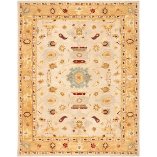 Handmade Tribal Ivory/ Gold Wool Rug (96 X 136) (IvoryPattern OrientalMeasures 0.625 inch thickTip We recommend the use of a non skid pad to keep the rug in place on smooth surfaces.All rug sizes are approximate. Due to the difference of monitor colors,