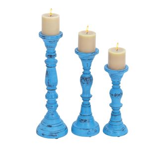 Set Of 3 Wood Candle Holder With Bell Shaped Design Base (Wood Setting IndoorIncludes Three (3) candle holdersColor/Finish Blue Dimensions18 inches high x 6 inches wide x 6 inches deep 15 inches high x 5 inches wide x 5 inches deep 12 inches high x 5 